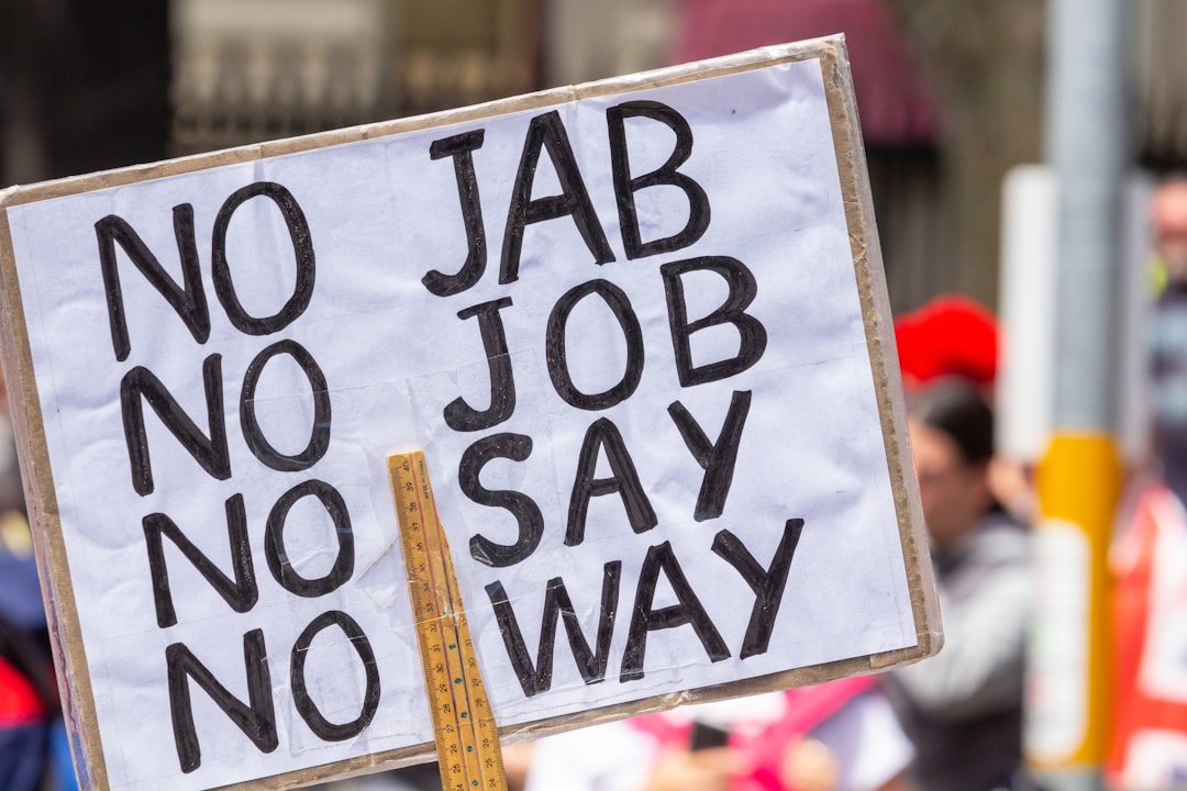 No Jab No Job sign at Melbournes Freedom protests rally and march in the city November 20th 2021 - over 200,000 people marched from Parliament to the Flagstaff Gardens. A happy family friendly crowd singing and chanting Kill The Bill and Sack Dan Andrews